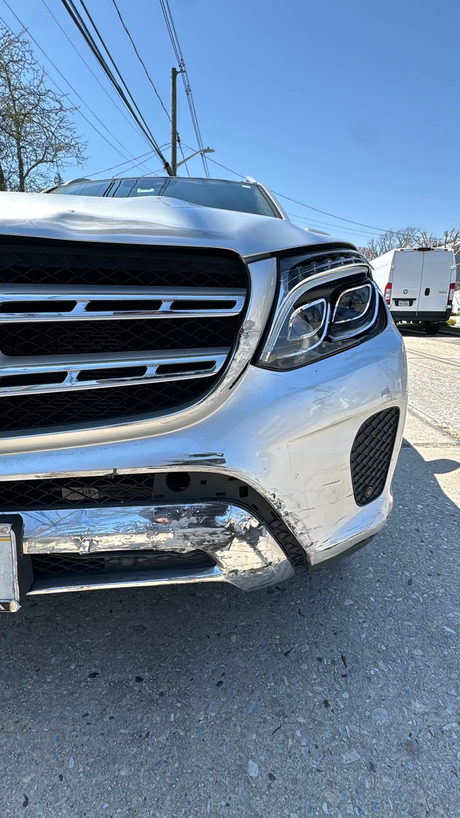 Mercedes SUV front bumper damage documented for a collision insurance estimate