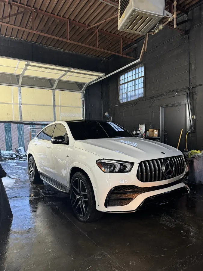 White Mercedes-AMG inside the shop